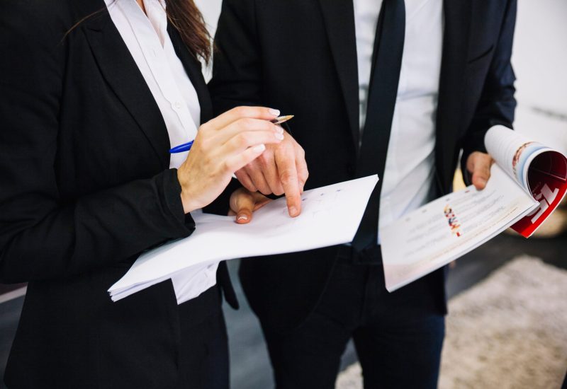 corporate-business-people-with-papers-scaled.jpg